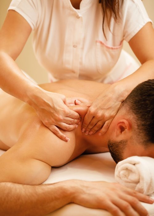 unrecognizable-therapist-massaging-man-s-shoulders-spa-treatment (1)